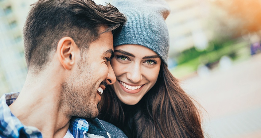 Couple with inlays and onlays smiles